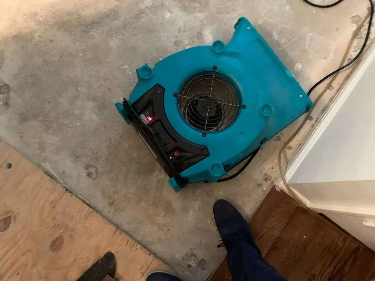 Air mover drying subfloor during Commercial Water Damage Restoration in Yulee